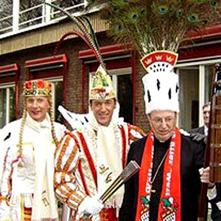 Cardinal Joachim Meisner wearing a feathered carnival hat